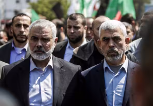 Featured Image: Yahya Sinwar (right) alongside Ismail Haniyeh (left) in Gaza city on March 25, 2017. Photo: AFP/Mahmud Hams.