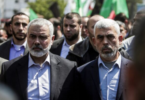 Featured Image: Yahya Sinwar (right) alongside Ismail Haniyeh (left) in Gaza city on March 25, 2017. Photo: AFP/Mahmud Hams.