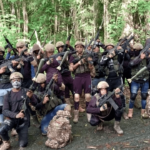 Members of the criminal gang Tren de Aragua pose in an undated video. File photo.