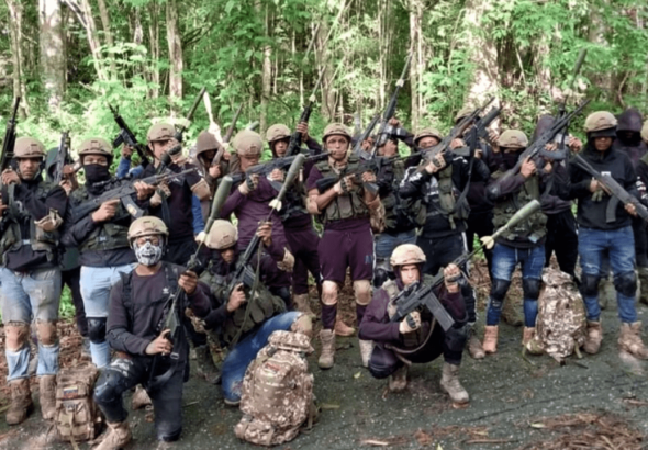 Members of the criminal gang Tren de Aragua pose in an undated video. File photo.