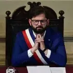 Chilean President Gabriel Boric listens during the closing ceremony of the Constitutional Process in which he received the text of the newly proposed Constitution, in the Hall of Honor of the National Congress in Santiago on November 7, 2023. Photo: Pablo Vera/AFP via Getty Images.
