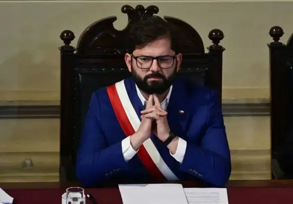 Chilean President Gabriel Boric listens during the closing ceremony of the Constitutional Process in which he received the text of the newly proposed Constitution, in the Hall of Honor of the National Congress in Santiago on November 7, 2023. Photo: Pablo Vera/AFP via Getty Images.