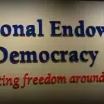 Inscription on a wall reads "National Endowment for Democracy, supporting freedom around the world." Photo: Common Dreams/file photo.