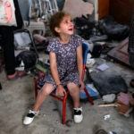 A child cries in the aftermath of an Israeli massacre in Gaza. Photo: AFP/file photo.