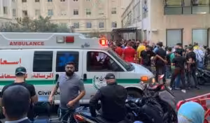 People gathered outside the American University of Beirut Hospital after several people wounded by handheld pagers in Beirut Lebanon on September 17, 2024. Photo: AP.