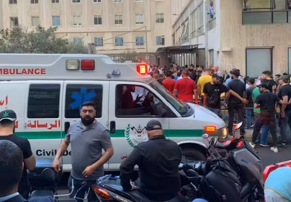 People gathered outside the American University of Beirut Hospital after several people wounded by handheld pagers in Beirut Lebanon on September 17, 2024. Photo: AP.