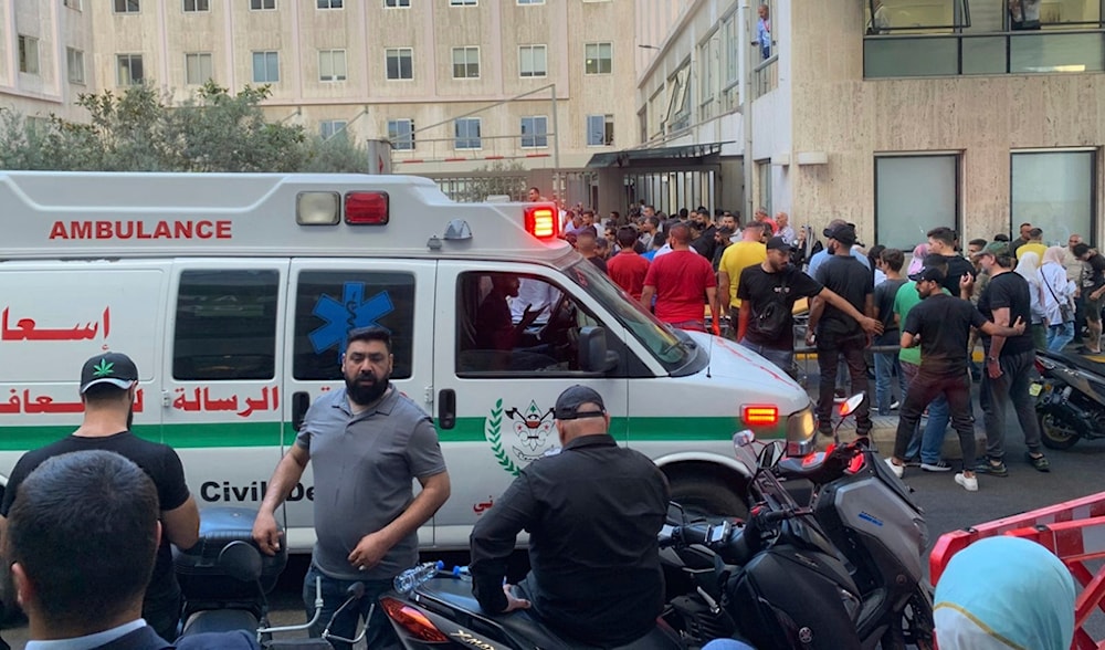 People gathered outside the American University of Beirut Hospital after several people wounded by handheld pagers in Beirut Lebanon on September 17, 2024. Photo: AP.