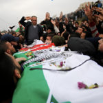 Palestinians carry the body of Basil al-Araj during his funeral in the West Bank village of Walajeh on March 17, 2017.  Photo AP/Nasser Shiyoukhi/file photo.