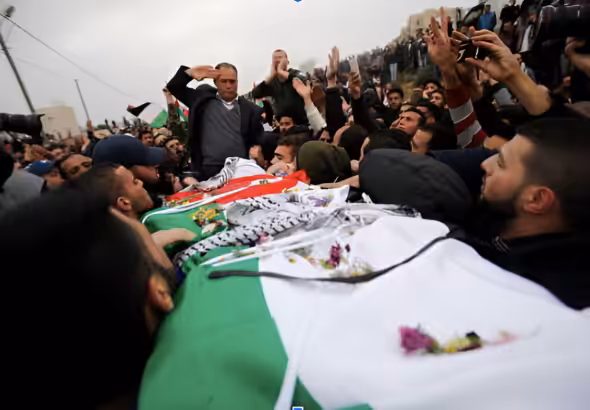 Palestinians carry the body of Basil al-Araj during his funeral in the West Bank village of Walajeh on March 17, 2017.  Photo AP/Nasser Shiyoukhi/file photo.