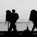 Silhouette of men in military gear. File photo.