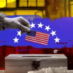 Election box where a US flag is cast as a ballot. Photo: Ali Al-Hadi Chemis/Al Mayadeen.