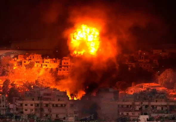 Flames and smoke rise over Beirut, Lebanon after an Israeli airstrike. Photo: Hussein Malla/AP.