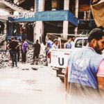 A United Nations worker surveys destruction caused by an Israeli airstrike on the Nuseirat camp in the central Gaza Strip on July 15, 2024. Photo: Majdi Fathi/NurPhoto.