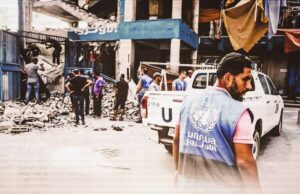 A United Nations worker surveys destruction caused by an Israeli airstrike on the Nuseirat camp in the central Gaza Strip on July 15, 2024. Photo: Majdi Fathi/NurPhoto.