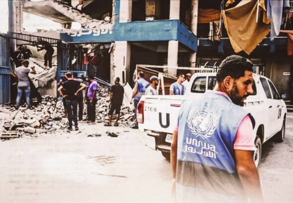 A United Nations worker surveys destruction caused by an Israeli airstrike on the Nuseirat camp in the central Gaza Strip on July 15, 2024. Photo: Majdi Fathi/NurPhoto.