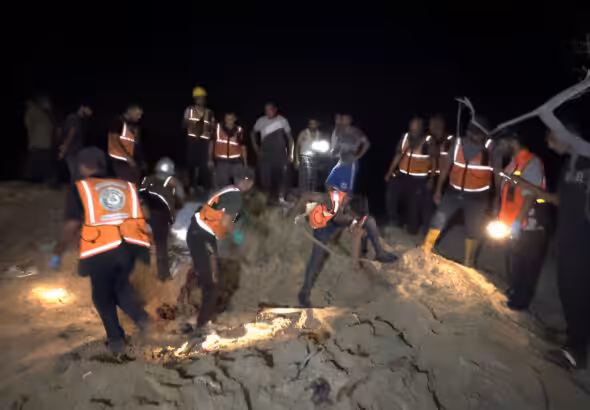 Palestinian search and rescue workers scouring the al-Mawasi refugee camp in the city of Khan Younis in southern Gaza Strip on September 10, 2024 after a new Israeli strike. Photo: PressTV.
