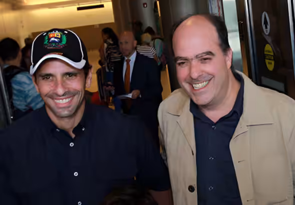 Henrique Capriles (left) and Julio Borges (right) during a public event in 2013. File photo.
