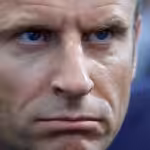 French President Emmanuel Macron looks on as he visits the Eurosatory land and airland defense and security trade fair, in Villepinte, north of Paris, June 13, 2022. Photo: Ludovic Marin/AP Photo.