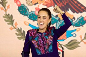 Claudia Sheinbaum raises her fist in celebration. Photo: CNN.