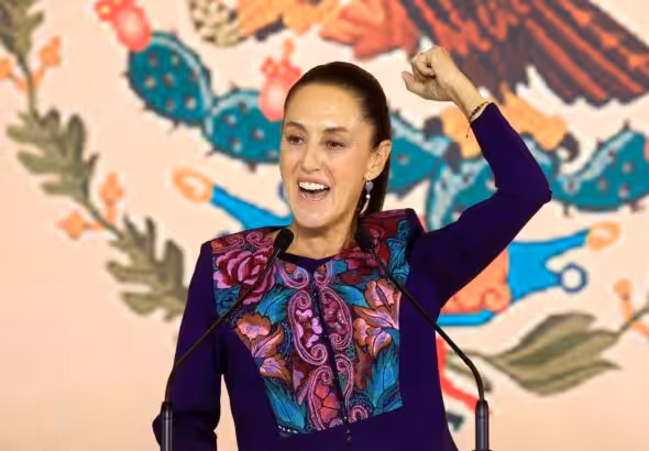 Claudia Sheinbaum raises her fist in celebration. Photo: CNN.