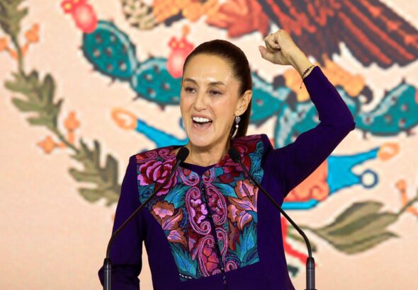 Claudia Sheinbaum raises her fist in celebration. Photo: CNN.