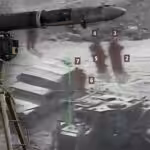 An anti-tank guided missile (ATGM) system over a photo of a Zionist convoy under fire. Photo: The Cradle.