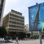 A banner with a photo of an Iranian hypersonic ballistic missile named "Fattah" with a caption reading "400 seconds to Tel Aviv," as seen in a street in Tehran, Iran June 8, 2023. Photo: Majid Asgaripour/WANA/file photo.