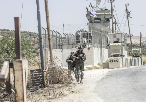 Israeli soldiers stand on guard at a checkpoint near Nablus, in the north of the West Bank, on July 25, 2024. Photo: Nasser Ishtayeh/SOPA Images/Sipa USA via AP