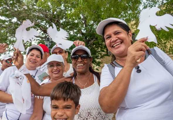 A group of Cubans pose for a photo during a protest demanding the closure of the United States' Guantánamo Naval Base and Prison in occupied Cuban territory, May 5, 2024.. Photo: Roger D. Harris.