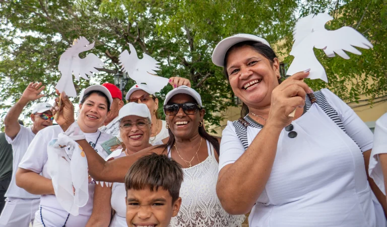 A group of Cubans pose for a photo during a protest demanding the closure of the United States' Guantánamo Naval Base and Prison in occupied Cuban territory, May 5, 2024.. Photo: Roger D. Harris.