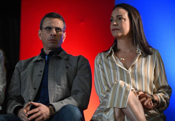 Venezuelan far-right opposition politicians Henrique Capriles (left) and María Corina Machado (right) at a political event, October 2023, Caracas. Photo: Federico Parra/AFP.