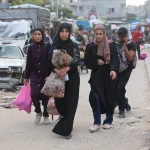 Palestinians flee from the Jabalia refugee camp in northern Gaza Strip amid intense Israeli airstrikes. Photo: Omar El-Qataa.