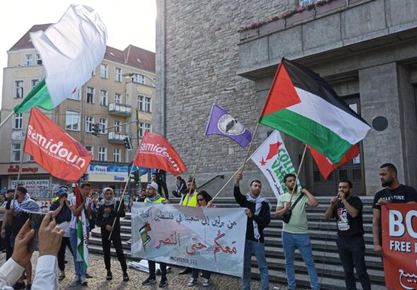 Pro-Palestine activists in Berlin march with flags of Palestine and Samidoun. Photo: X/@SamidounPP.
