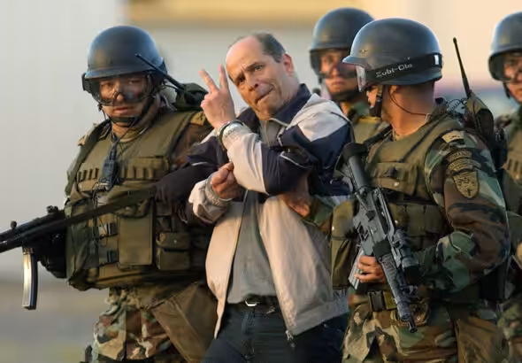 FARC leader Ricardo Palmera, better known as Simón Trinidad, brought to Bogota, Colombia after his capture in Ecuador, January 2004. Photo: Miguel Menéndez/EPA/Corbis/file photo.