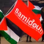 Dozens of protesters from the Samidoun organization gathering in front of the Muelheim train station in Cologne, Germany, on April 15, 2023, to commemorate Palestinian Prisoners’ Day. Photo: Ying tang/Nurphoto via zuma press apaimages.