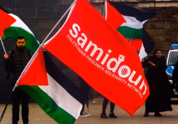 Dozens of protesters from the Samidoun organization gathering in front of the Muelheim train station in Cologne, Germany, on April 15, 2023, to commemorate Palestinian Prisoners’ Day. Photo: Ying tang/Nurphoto via zuma press apaimages.