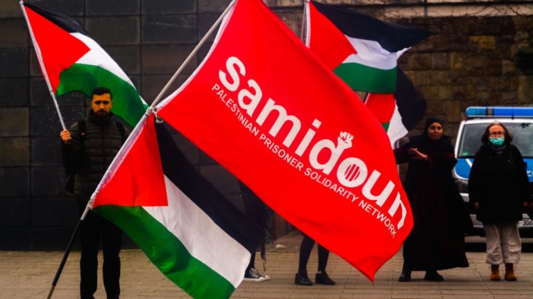 Dozens of protesters from the Samidoun organization gathering in front of the Muelheim train station in Cologne, Germany, on April 15, 2023, to commemorate Palestinian Prisoners’ Day. Photo: Ying tang/Nurphoto via zuma press apaimages.