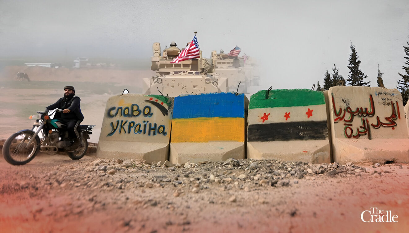 Concrete blocks with the Ukrainian flag and HTS' fake Syrian flag painted on them, along with pro-Ukraine and pro-separatist slogans. Photo: The Cradle.