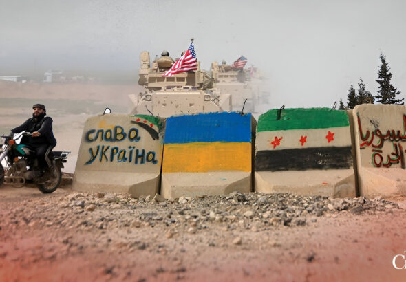 Concrete blocks with the Ukrainian flag and HTS' fake Syrian flag painted on them, along with pro-Ukraine and pro-separatist slogans. Photo: The Cradle.