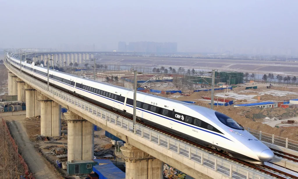 A bullet train passes over Yongdinghe Bridge in Beijing Wednesday, Dec. 26.2012. Photo: Jiao Hongtao/Xinhua.