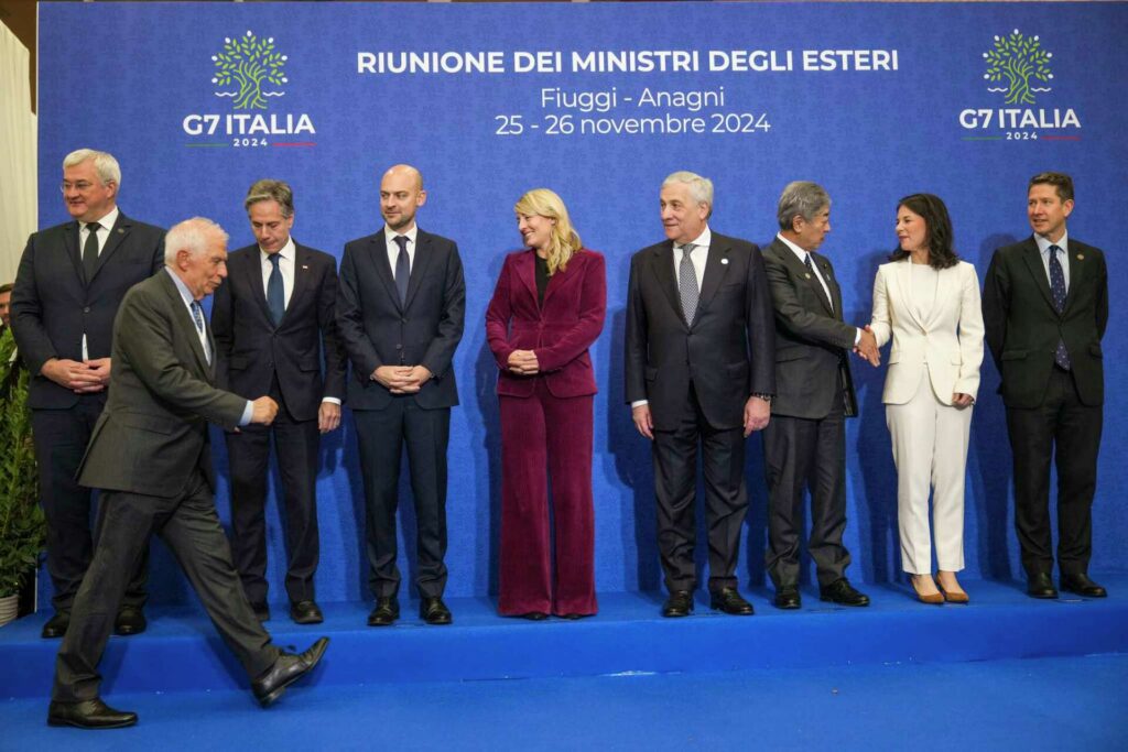 European Union foreign policy chief Josep Borrell, front, arrives late to pose for a family photo with, from left, Ukrainian Foreign Minister Andrii Sybiha, US Secretary of State Antony Blinken, French Foreign Minister Jean-Noël Barrot, Canada's Foreign Minister Melanie Joly, Italian Foreign Minister Antonio Tajani, Japanese Foreign Minister Takeshi Iwaya, German Foreign Minister Annalena Baerbock, Britain's Foreign Office Political Director Christian Turner at the G7 Summit of foreign Ministers in Italy, Tuesday, Nov. 26, 2024. Photo: Alessandra Tarantino/AP.