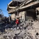 A boy walks among the rubble of a house destroyed in an Israeli strike at the Nuseirat refugee camp, in the central Gaza Strip. Photo: AFP