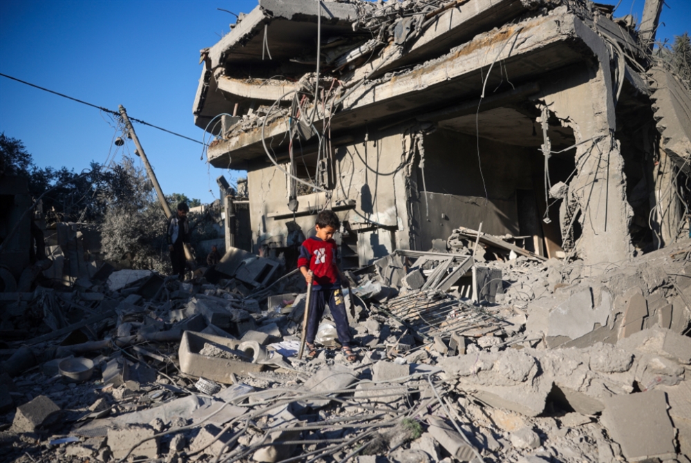 A boy walks among the rubble of a house destroyed in an Israeli strike at the Nuseirat refugee camp, in the central Gaza Strip. Photo: AFP