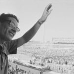 Muammar al-Quaddafi waves to demonstrators gathered to show support for his return after he resigns as leader of the Revolutionary Command Council. Photo: Genevieve Chauvel/Sygma/Sygma via Getty Images.