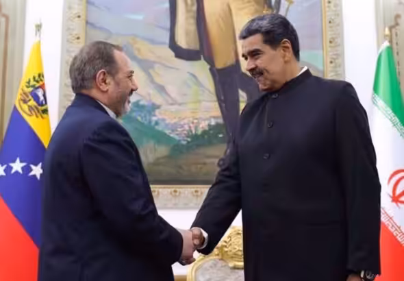 Iran's Defense Minister Brigadier General Aziz Nasirzadeh (Left) shakes hands with Venezuelan President Nicolas Maduro in Caracas on November 21, 2024. Photo: X