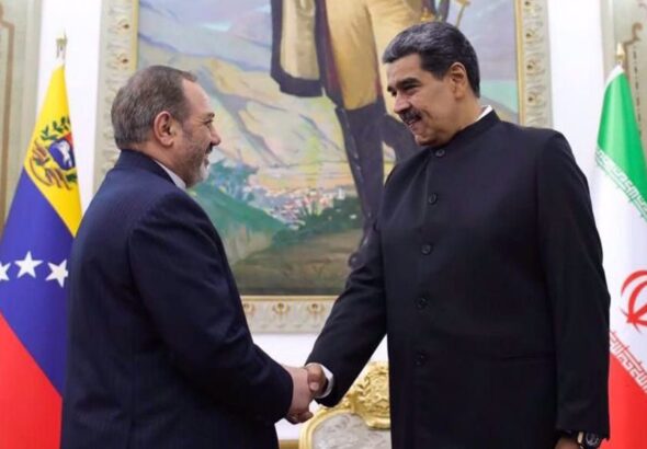 Iran's Defense Minister Brigadier General Aziz Nasirzadeh (Left) shakes hands with Venezuelan President Nicolas Maduro in Caracas on November 21, 2024. Photo: X
