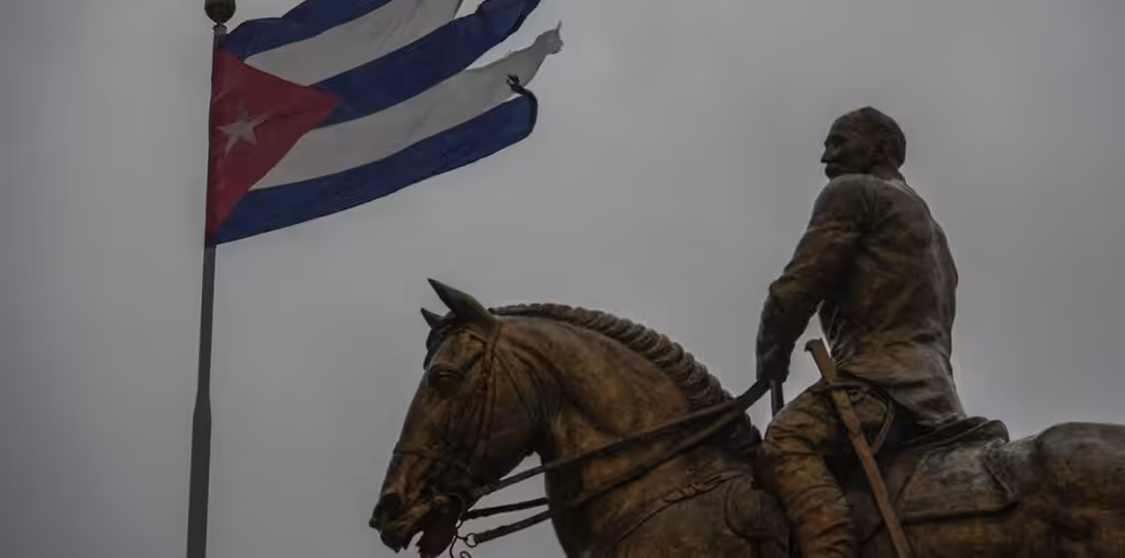 A Cuban flag shredded by the winds of Hurricane Rafael flies above the statue of General Calixto Garcia in Havana, Cuba, November 6, 2024. Photo: Morning Star/File photo.