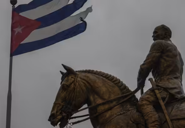 A Cuban flag shredded by the winds of Hurricane Rafael flies above the statue of General Calixto Garcia in Havana, Cuba, November 6, 2024. Photo: Morning Star/File photo.