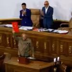 Member of the National Assembly and Vice president of the United Socialist Party of Venezuela (PSUV) Diosdado Cabello, holds the recently approved bill regulating non-governmental organizations (NGOs), during an ordinary session in Caracas, Venezuela August 15, 2024. Photo: Leonardo Fernandez/Reuters.