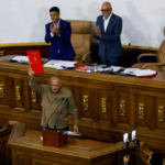 Member of the National Assembly and Vice president of the United Socialist Party of Venezuela (PSUV) Diosdado Cabello, holds the recently approved bill regulating non-governmental organizations (NGOs), during an ordinary session in Caracas, Venezuela August 15, 2024. Photo: Leonardo Fernandez/Reuters.